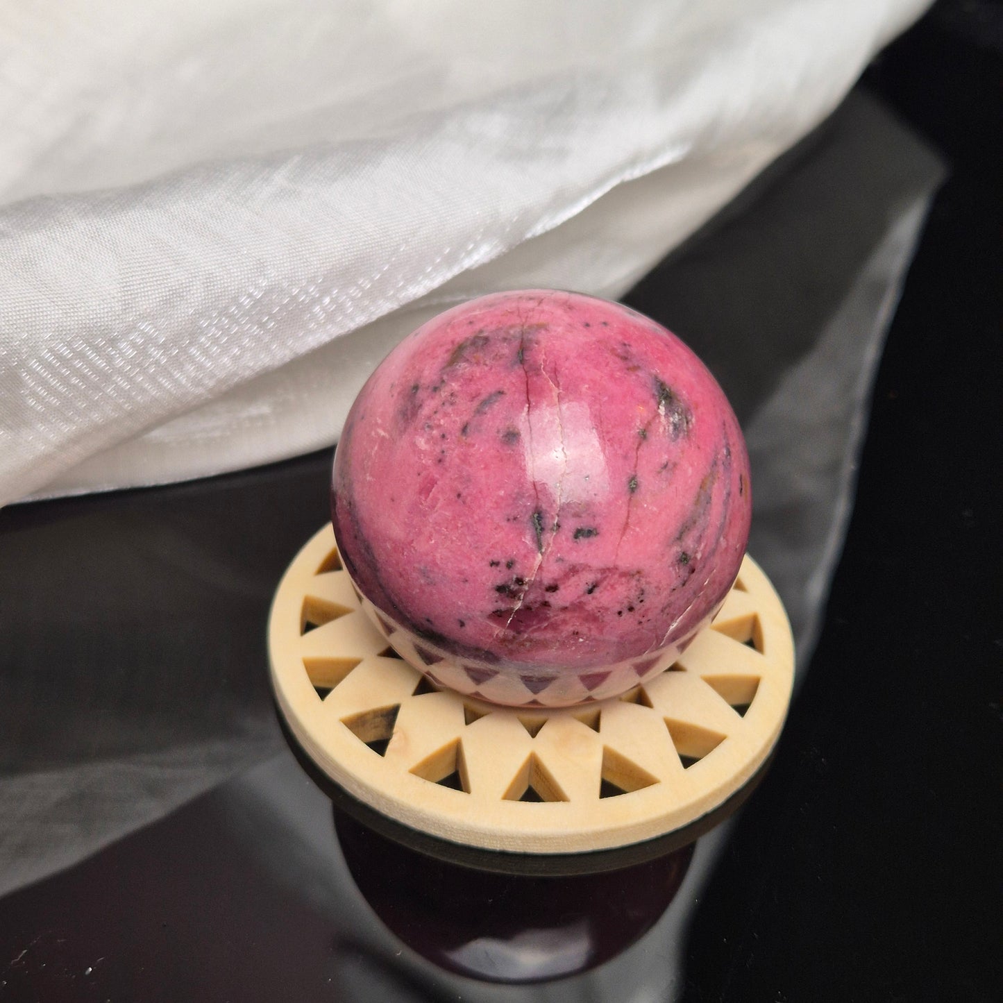 Bubblegum pink rhodonite sphere 1 (Peru)