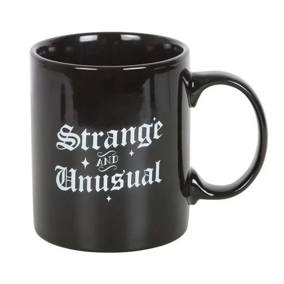 Strange & Unusual mug