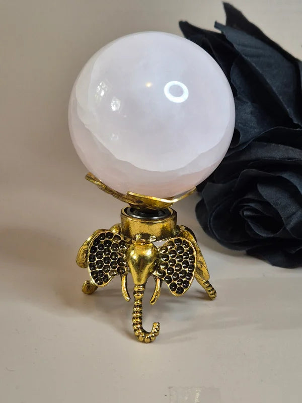 Spinning sphere stand elephant gold