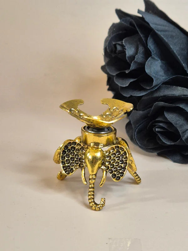 Spinning sphere stand elephant gold