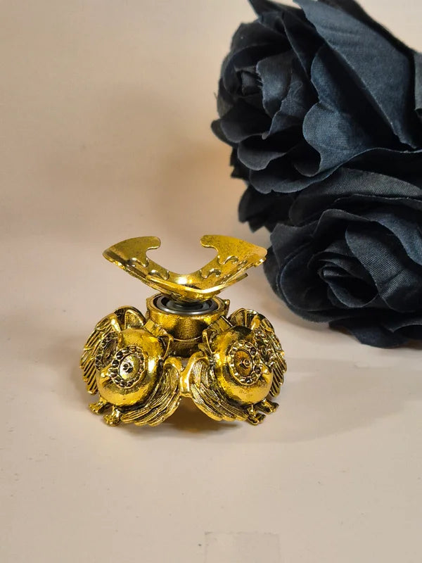 Spinning sphere stand owl gold