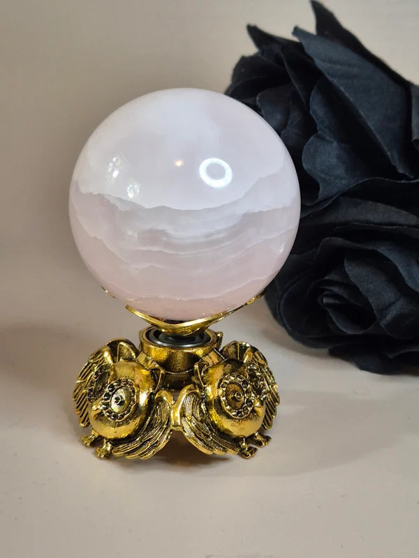 Spinning sphere stand owl gold