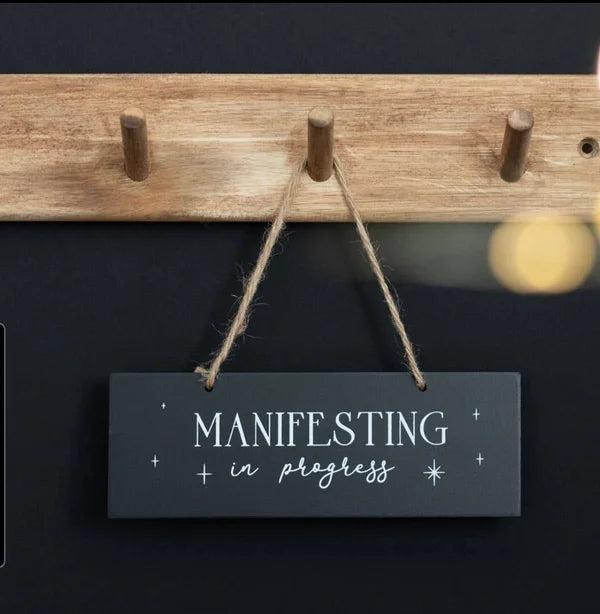 Wooden sign manifesting