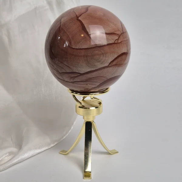 Spinning sphere stand gold