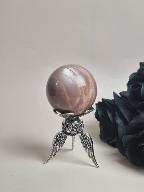 Spinning sphere stand wings silver