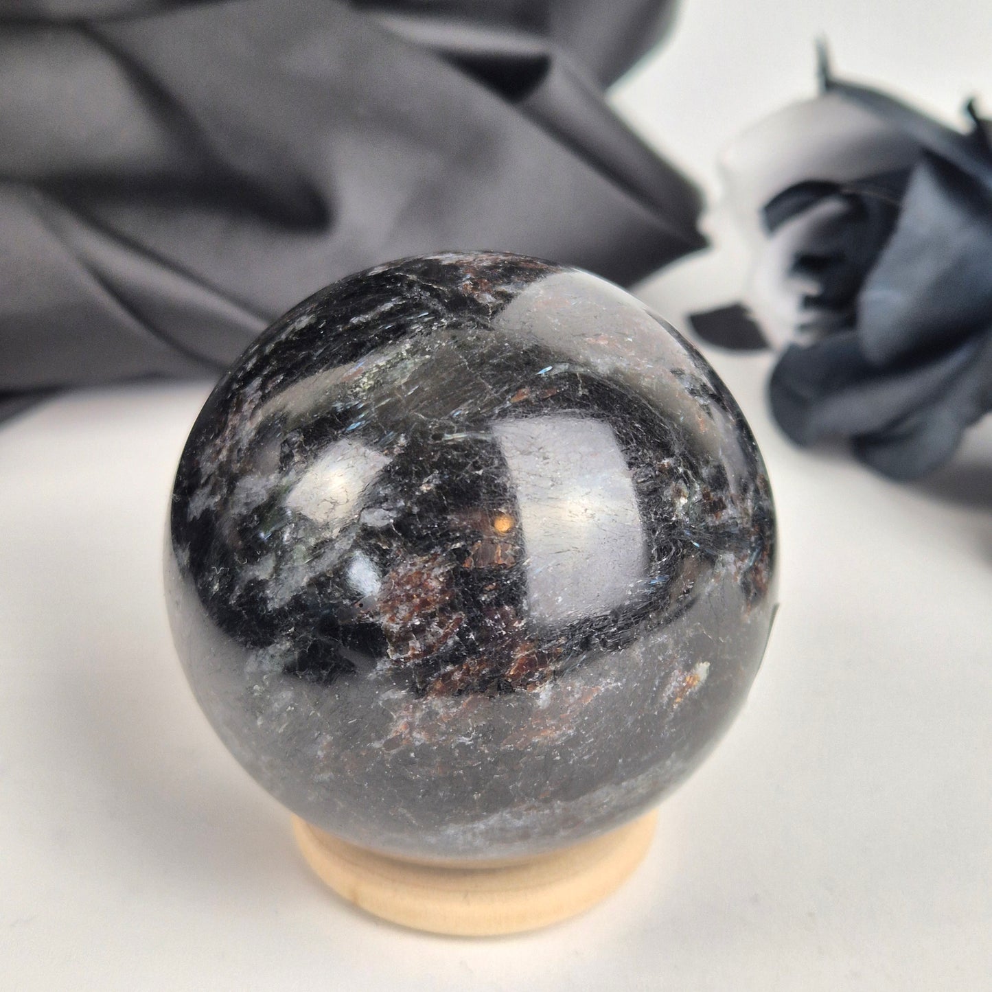 Garnet in arfvredsonite sphere