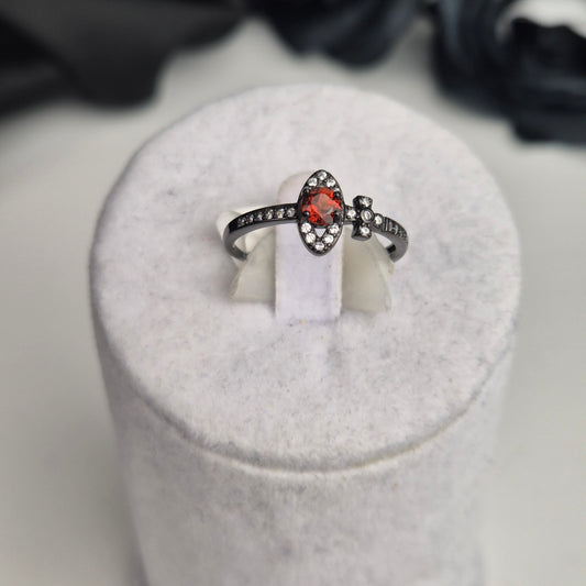 Garnet ring black cross