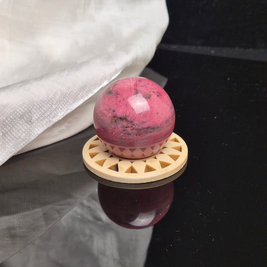 Bubblegum pink rhodonite sphere 1 (Peru)