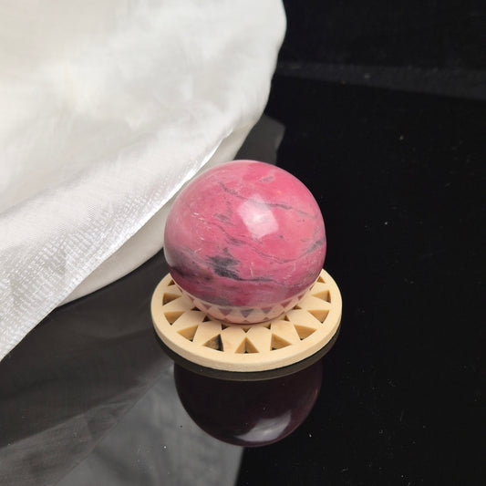 Bubblegum pink rhodonite sphere 2 (Peru)