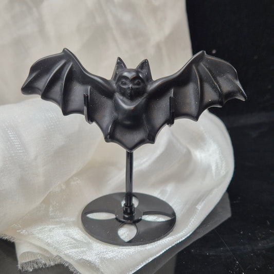 Black obsidian bat on stand
