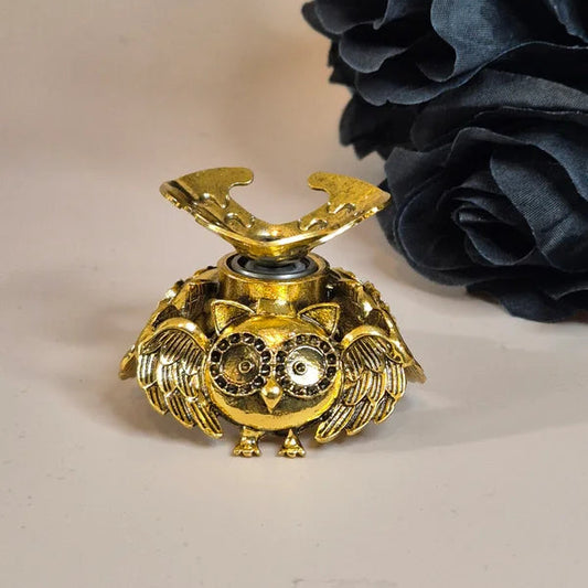 Spinning sphere stand owl gold